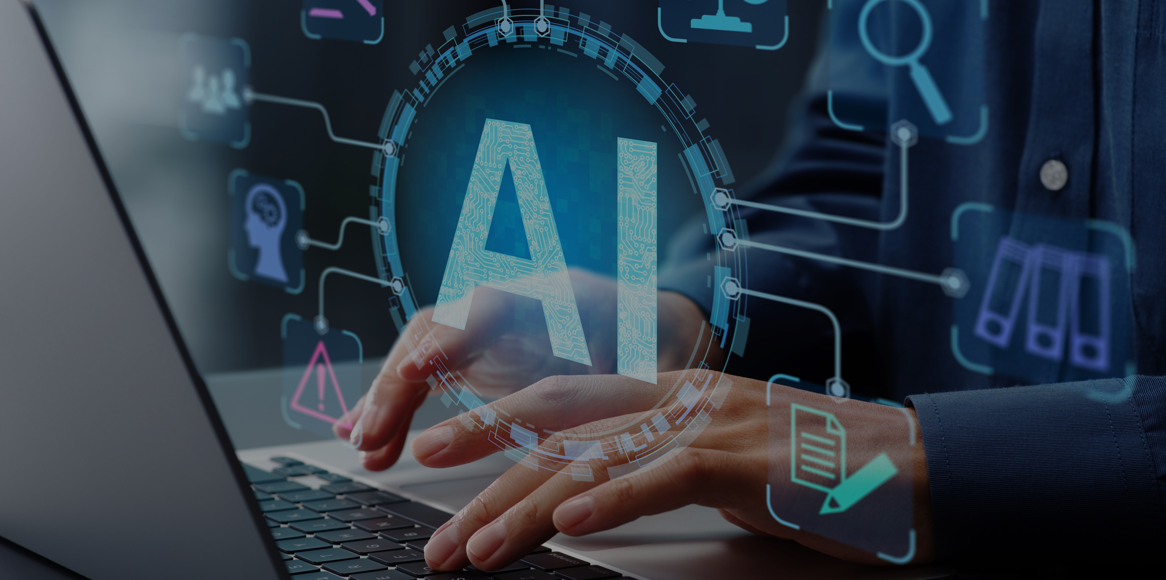 Businessman typing on laptop computer keyboard at desk in office.